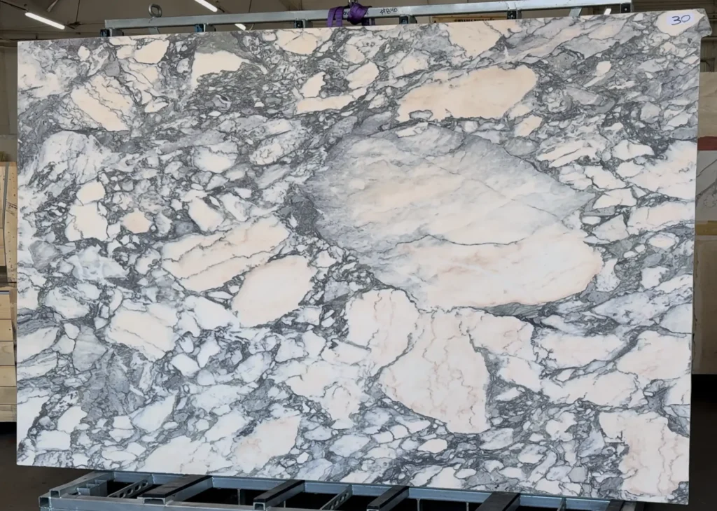 Arabescato Rosa marble slabs from Italy with soft pink tones and bold gray veining