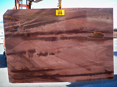 Full slab of Desert Blend Meta Quartzite featuring warm rose, taupe, brown, and charcoal movement quarried in Nevada.