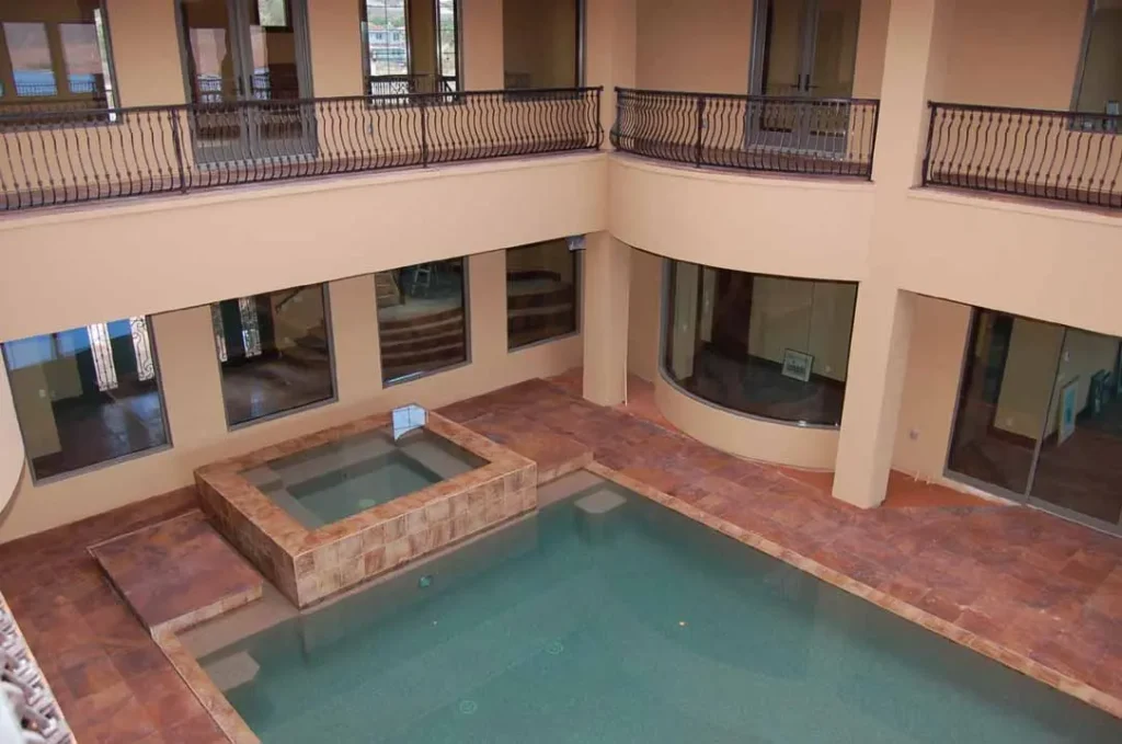 Sierra Smoke Meta Quartzite flooring and pool surround in a luxury hospitality spa with indoor swimming pool and spa.