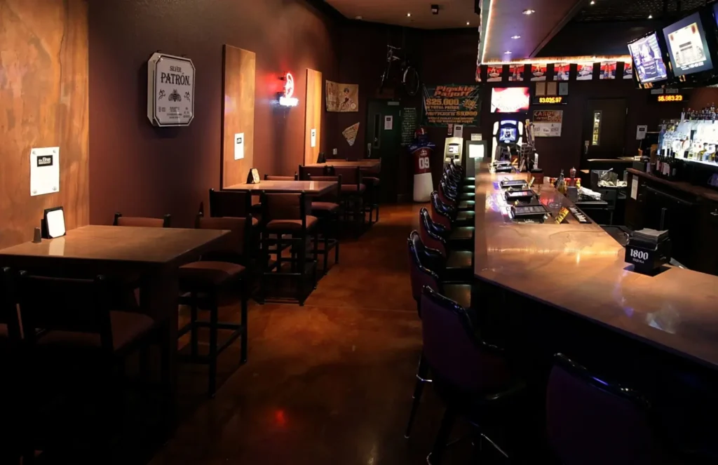 Sports bar featuring Tupelo Honey meta quartzite countertops, wall panels, and flooring in warm gold and amber tones.