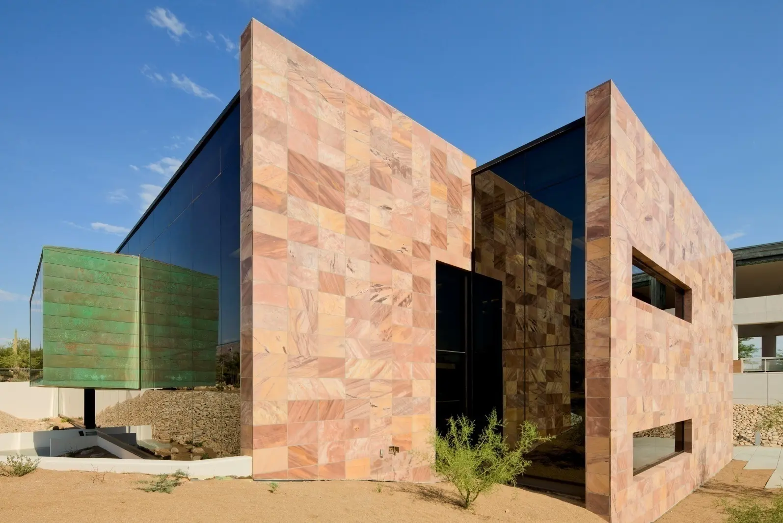 Modern luxury residence clad in Tupelo Honey Meta Quartzite, an American natural stone quarried in Goodsprings, Nevada.