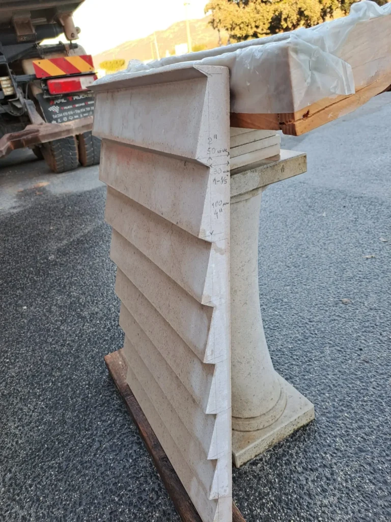 Custom-fabricated natural stone water feature component with precision-cut stepped profile by The World of Stone