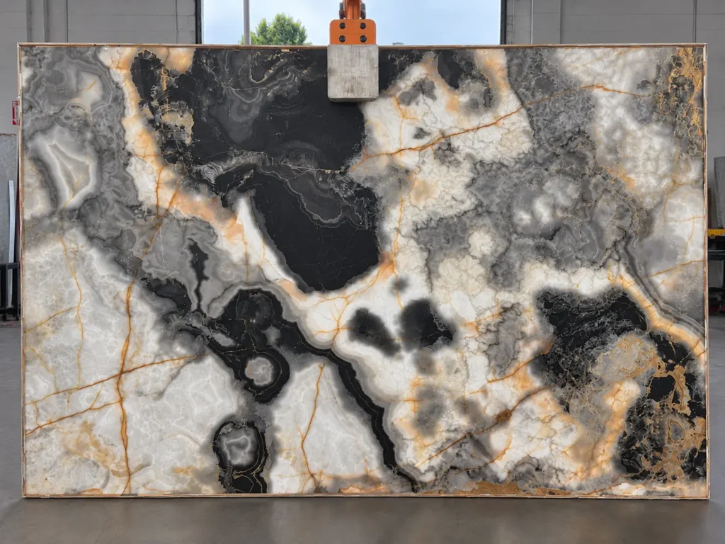 Silver Grey Onyx featuring dramatic black mineral formations, silver-gray crystalline patterns, translucent white areas, and delicate amber-gold veining.